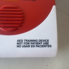 5 American Red Cross AED Training Device In English/Spanish With Carrier Bag.