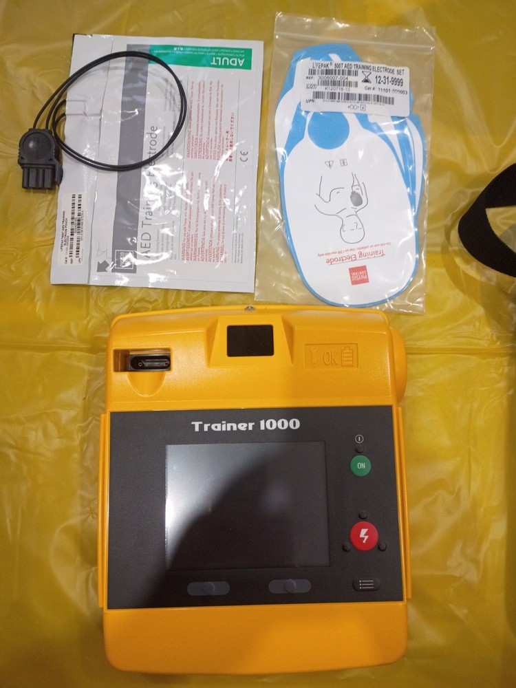 AED Trainer 1000 with CPRTraining Manikin Excellent ConditionUsed Only Few Times